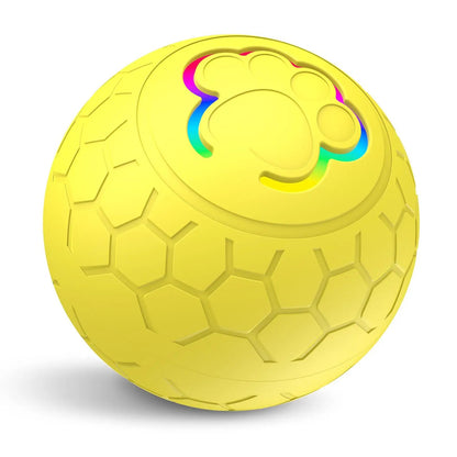 Balle interactive jaune pour chien avec LED intégrée et surface antidérapante. Disponible chez Museau Dort