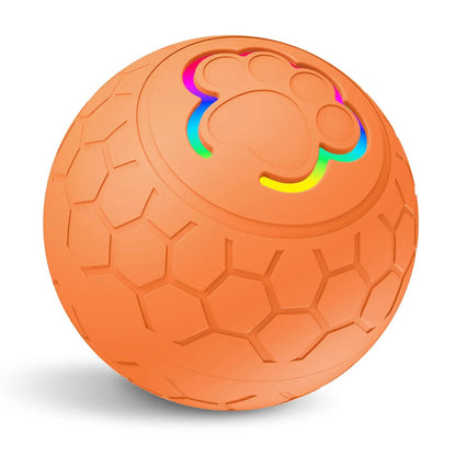 Balle interactive orange pour chien avec surface antidérapante et LED multicolores. Disponible chez Museau Dort