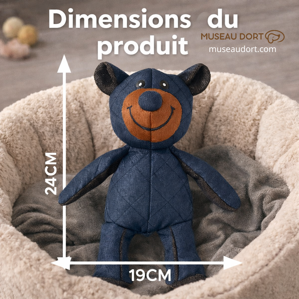 Dimensions de la peluche pour chien indestructible 24 cm par 19 cm, posée dans un lit pour chien, Museau Dort