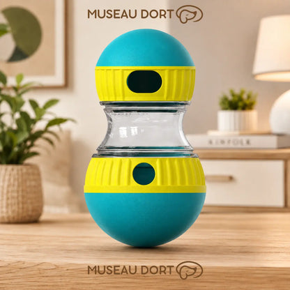 Jouet distributeur de croquettes bleu et jaune pour chien avec ouverture réglable dans un salon moderne