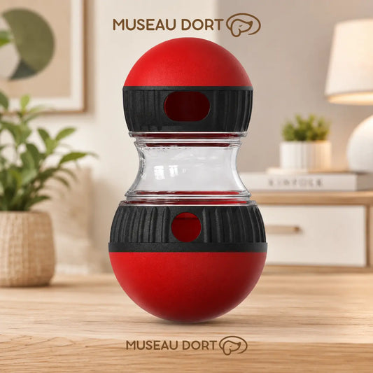 Jouet distributeur de croquettes rouge pour chien avec ouverture réglable dans un salon moderne