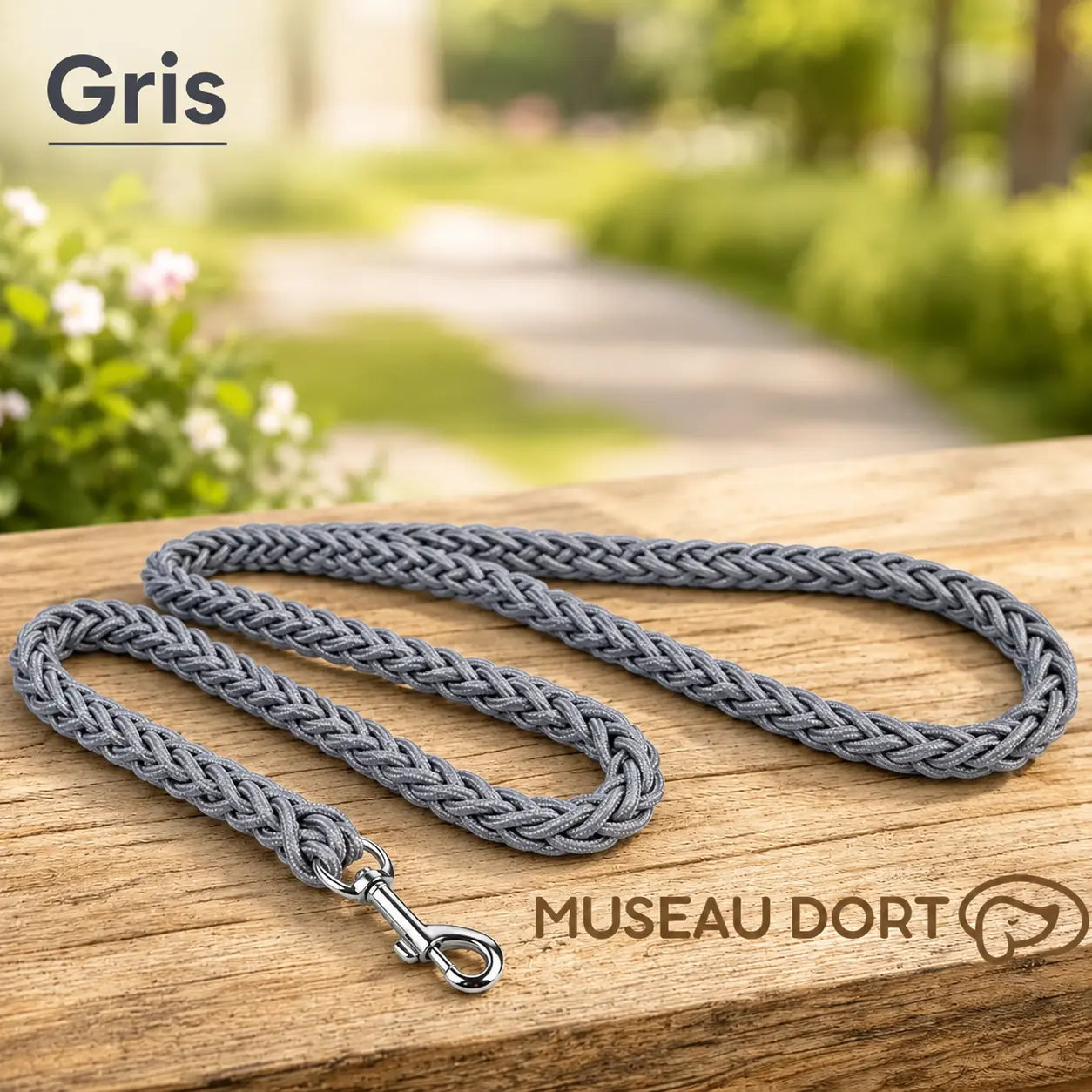 Laisse corde grise pour chien en nylon tressé de 2 cm posée à plat sur une table en bois